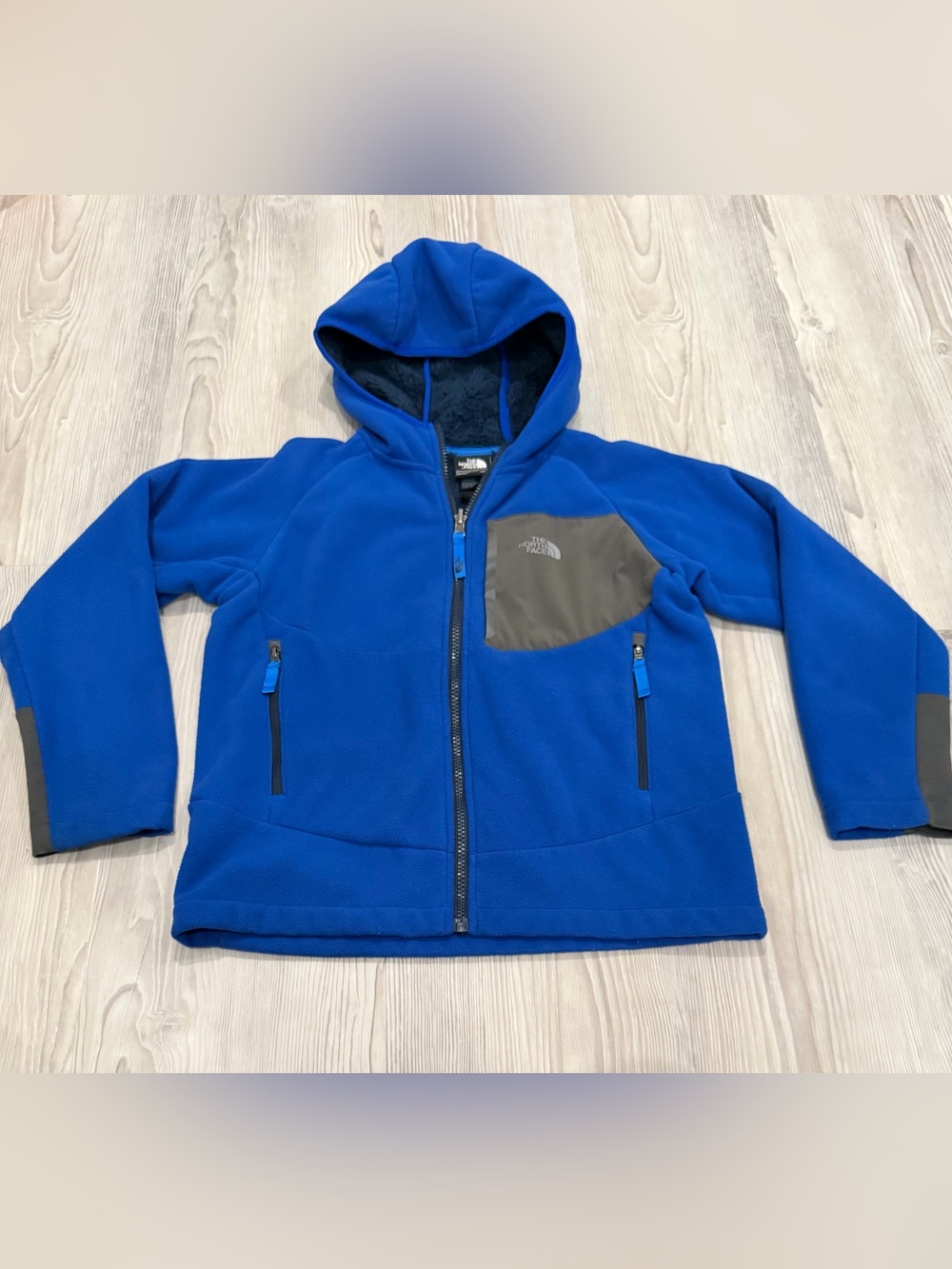 The North Face Kids’ Blue Hooded Fleece Jacket. Size M (10/12) GUC.